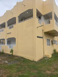 an external view of a building with balconies at Chambre simple in Libreville