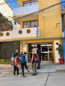 a group of people standing outside of a building at La Casa de Maruja B&B in Huaraz