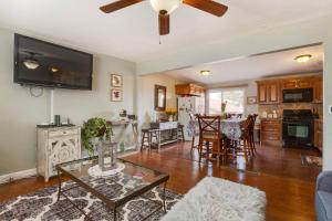 a living room with a couch and a table at Fly Away Home in West Jordan