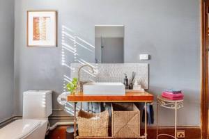 a bathroom with a sink and a toilet at William Arnott Boutique Accommodation in Morpeth +58 photos