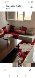 a living room with a couch and a coffee table at Résidence Hala in Tan-Tan