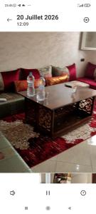 a living room with a couch and a coffee table at Résidence Hala in Tan-Tan
