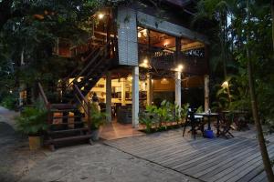 a building with a staircase on the side of it at Sambor Village Hotel in Kompong Thom