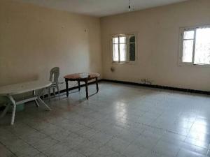 an empty room with a table and chairs in it at Akr appartement in Al Hoceïma +9 photos