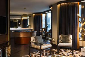 a living room with a pool table and a bar at Renaissance Chicago Downtown Hotel in Chicago