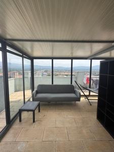 a living room with a couch and a table at Valença RoofTop by Beeflats BnB in Valença +3 photos
