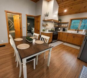 a kitchen and dining room with a table and chairs at Honey Ridge Forest Retreat in South Bloomingville