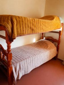 two bunk beds in a small room with at Cabañas Puesta del Sol in Purmamarca
