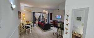 a living room with a kitchen and a dining room at Nuestra Recova 2 en Pilar BsAs in Pilar
