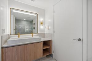 a bathroom with a sink and a mirror at NEW Luxury Bay View Downtown 1 Bedroom in Miami