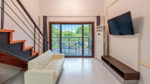a living room with a couch and a flat screen tv at Gapyeong Hue 910 Pension in Gapyeong +12 photos