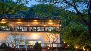 a white house with lights on it at night at Gapyeong Hue 910 Pension in Gapyeong