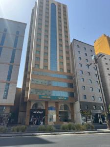 a large building with a store in front of it at فندق فيفيان الجميزة in An Naqāʼ