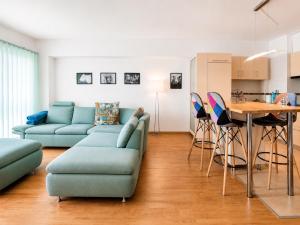 a living room with a couch and a table at Red Hotel Accommodation in Cluj-Napoca