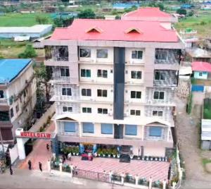 an overhead view of a building with a red roof at Hotel Delw in Bacha