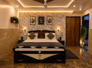 a bedroom with a bed in a room at RadhaRaman StayInn in Mathura