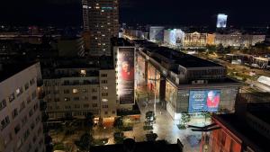 a view of a city at night with buildings at Studio 13 Warsaw in Warsaw