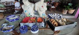 a buffet of food on a glass table at Casa Pahpaqui in Tequisquiapan