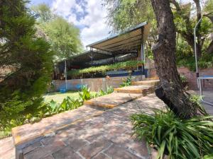 a building with a tree in front of it at Casa Pahpaqui in Tequisquiapan