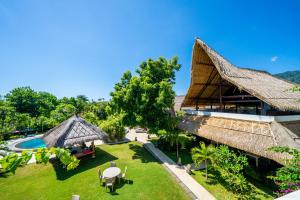 an aerial view of a resort with a pool at Bunga Laut Bungalow in Amed