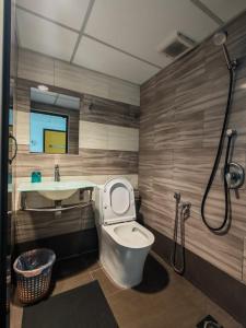 a bathroom with a toilet and a sink and a shower at Comfort Two Hotel in Malacca +45 photos