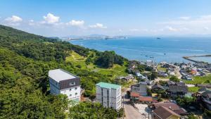 an aerial view of a city and the ocean at Muuido Haedungsil Pension in Incheon