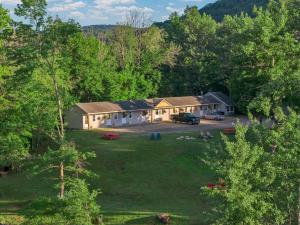 an aerial view of a house with a yard at Berkshire Lake Lodge in Becket