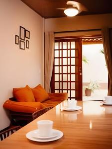 a living room with a couch and a table at Vila dos Poetas in Barreirinhas