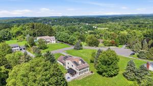 an aerial view of a large estate with a mansion at Summit Sanctuary with EV Ready Mountain Views in Poughkeepsie