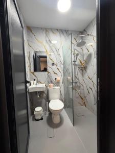a bathroom with a toilet and a sink at Еко Къмпинг Созопол in Sozopol +23 photos