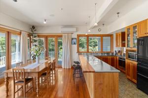 a kitchen with wooden cabinets and a wooden counter top at Sheena Apartment in Manila