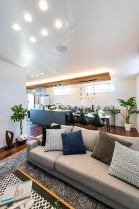 a living room with a couch and a bar at ResoLife in Kochi