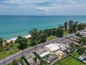 an overhead view of a road next to the ocean at Turtle Tales-Tao Kra in Thai Muang