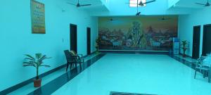a room with a swimming pool with a painting on the wall at Brij Dham Ashram in Vrindāvan