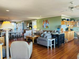 a living room with a couch and a table at Clamelot in Holden Beach
