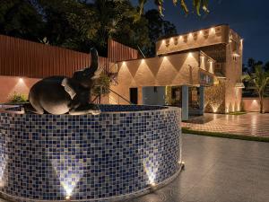 a statue of a rabbit sitting on top of a building at Happy Mates Forest Villa in Pondicherry