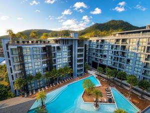 an aerial view of apartment buildings with a swimming pool at Oasis in CityGate 1BR Suite in Kamala Beach