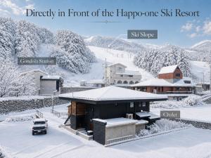 icity in front of the hippippi one ski resort ski slope ski shop church at Jaune Chalet in Hakuba