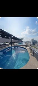 a large swimming pool on top of a building at Emanzara in Islamabad