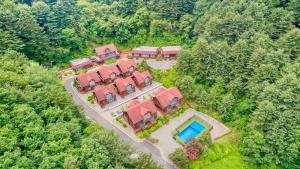 an aerial view of a house with a swimming pool at Gapyeong Humantown Pension in Gapyeong