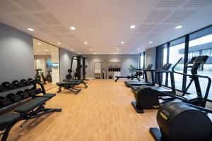 a gym with treadmills and ellipticals in a room at INNSiDE by Meliá Liverpool in Liverpool
