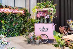 a flower space with a pink bike with a flower space sign at INNSiDE by Meliá Liverpool in Liverpool +53 photos
