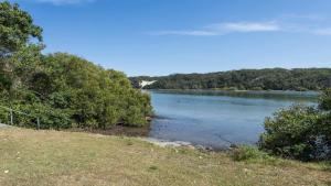 a view of a river with trees on the shore at Wooli House in Wooli