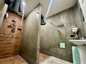 a bathroom with a shower and a sink at 9 mins to BTS Private King share Bathroom Kitchen in Amphoe Phra Khanong