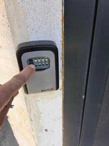 a hand is pushing a button on a door at Fragma in Targovishte