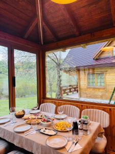 a table with plates of food on top of it at Bujtina Pepushaj Lepushe in Lëpushë