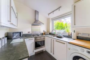 a kitchen with white appliances and a window at 2 Bed in Ambleside oc-lr059 in Ambleside