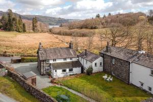 an aerial view of a group of buildings in a field at 2 Bed in Ambleside oc-lr059 in Ambleside