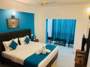 Säng eller sängar i ett rum på Hotel Cloud Coorg +29 foton
