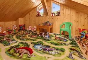 a room with a rug with toys on it at Casa Dava in Râşnov